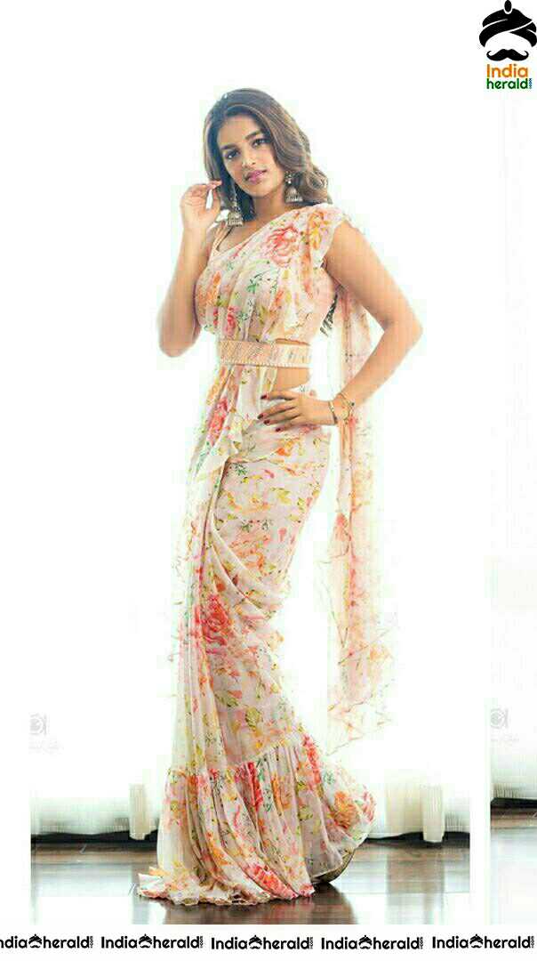 Niddhi Agerwal Hot In Sleeveless Blouse And White Transparent Saree