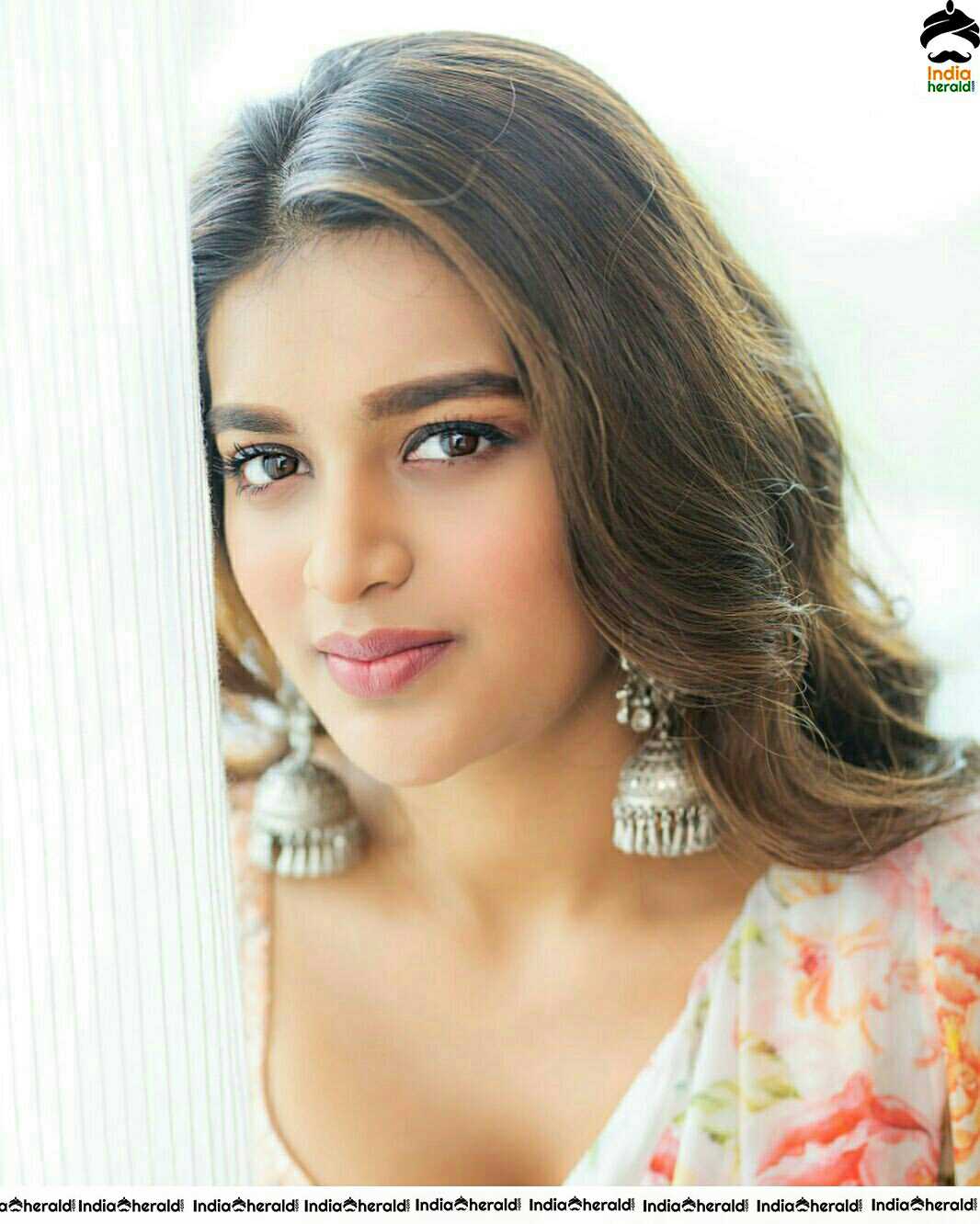Niddhi Agerwal Hot In Sleeveless Blouse And White Transparent Saree