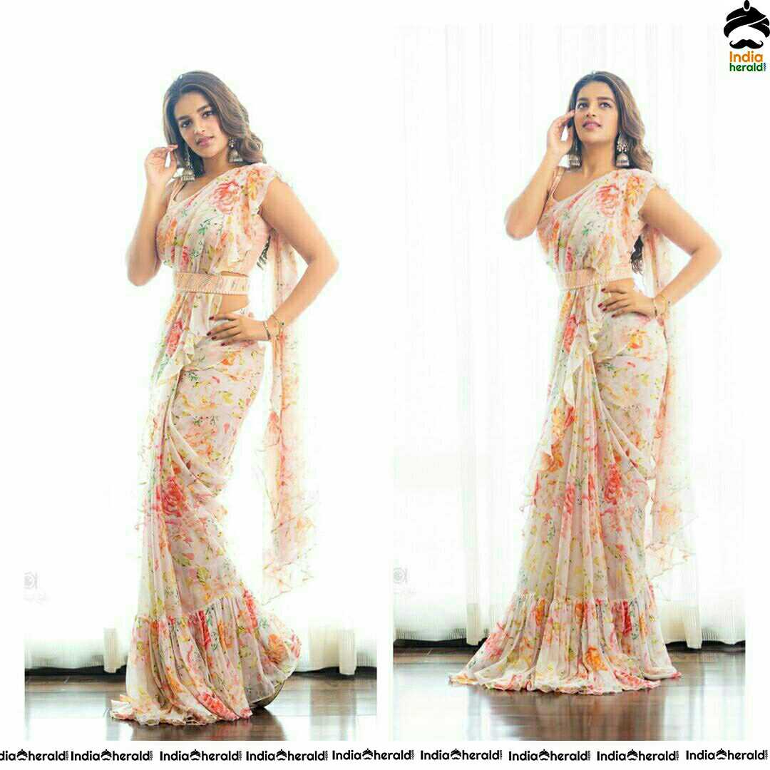 Niddhi Agerwal Hot In Sleeveless Blouse And White Transparent Saree