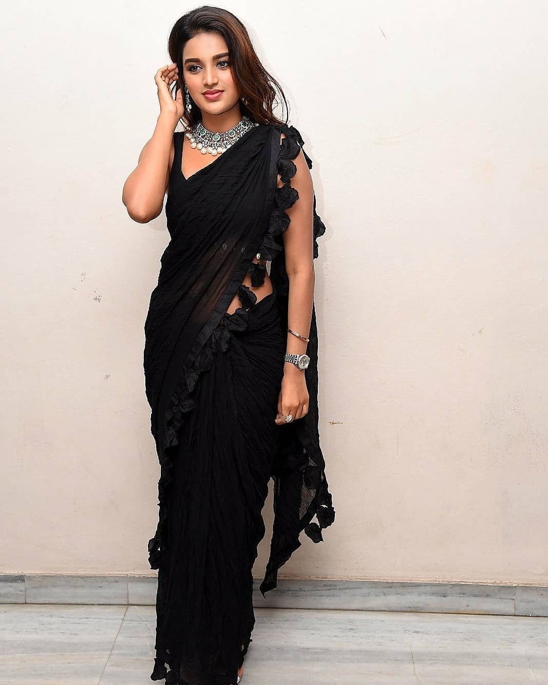 Niddhi Agerwal Showing Her Sexy Waist InTransparent Black Saree