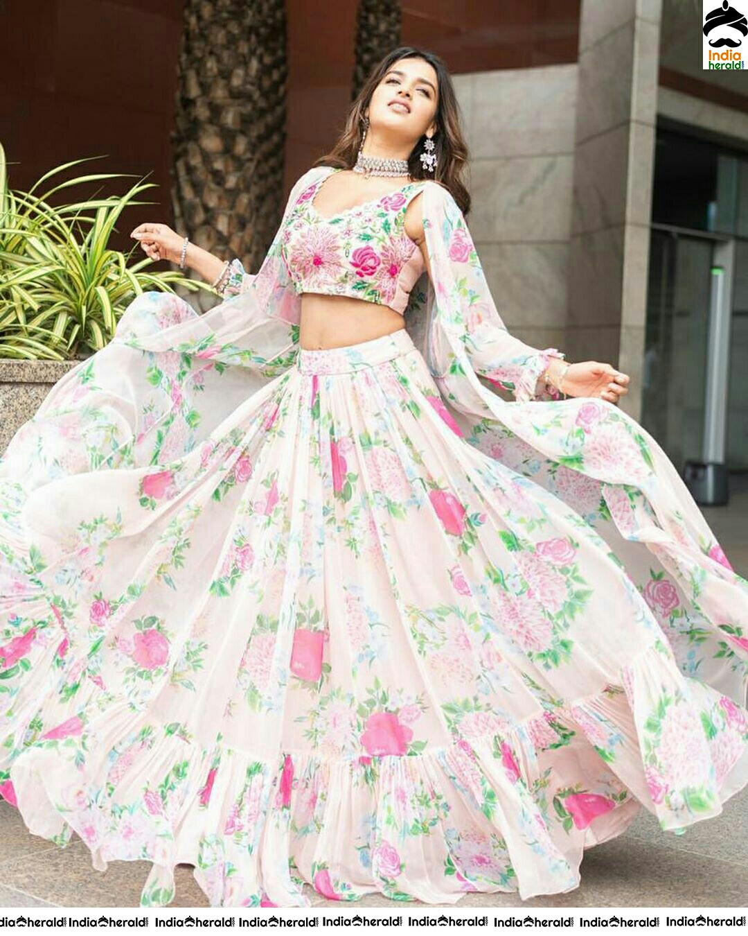 Nidhhi Agerwal Graceful In White And Pink Flower Design Choli