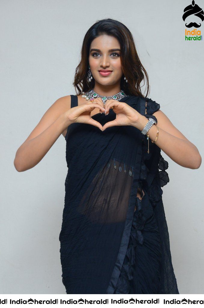 Nidhhi Agerwal Throwback Hot Photos in Sleeveless Blouse and Transparent Saree