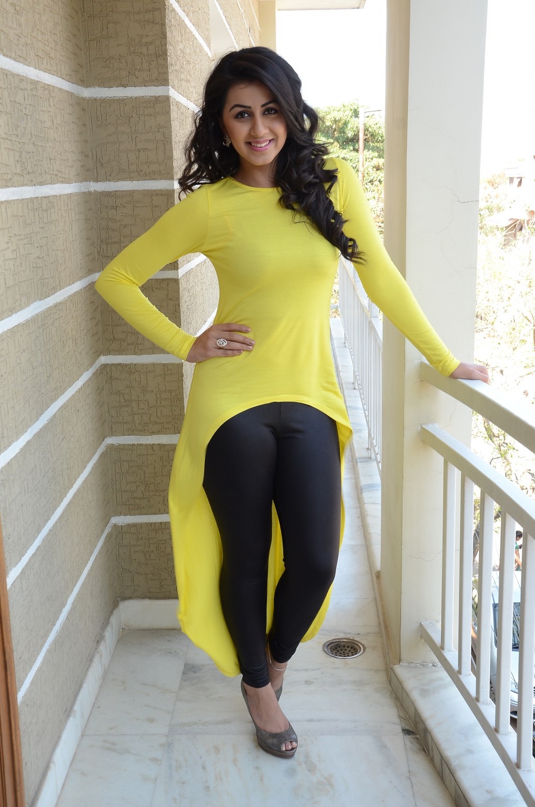 Nikki Galrani In A Tight Yellow Tops And Black Leggings