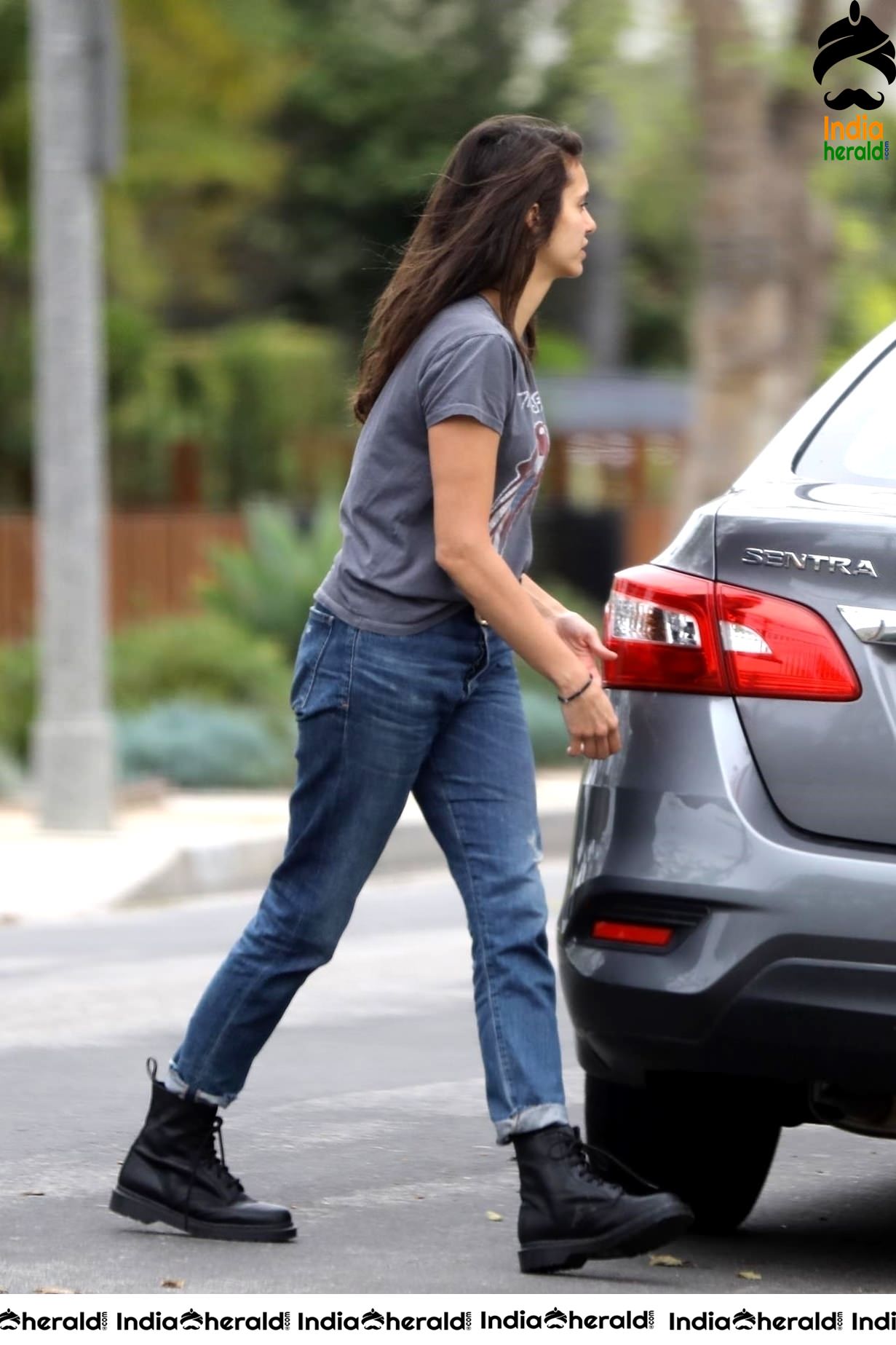 Nina Dobrev caught by Paparazzi while carrying furniture to a car in Los Angeles