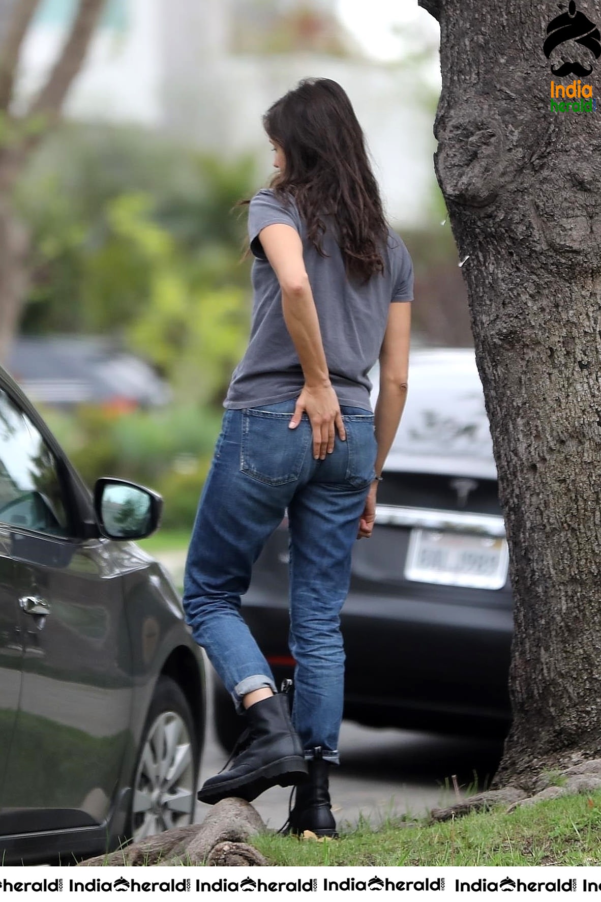 Nina Dobrev caught by Paparazzi while carrying furniture to a car in Los Angeles