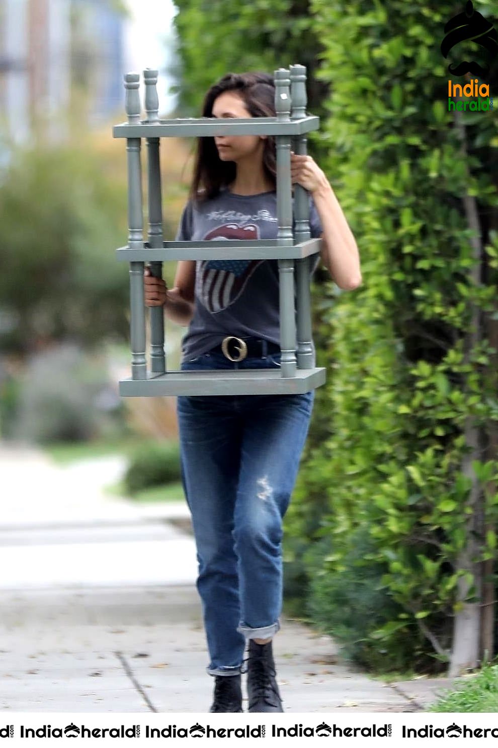 Nina Dobrev caught by Paparazzi while carrying furniture to a car in Los Angeles