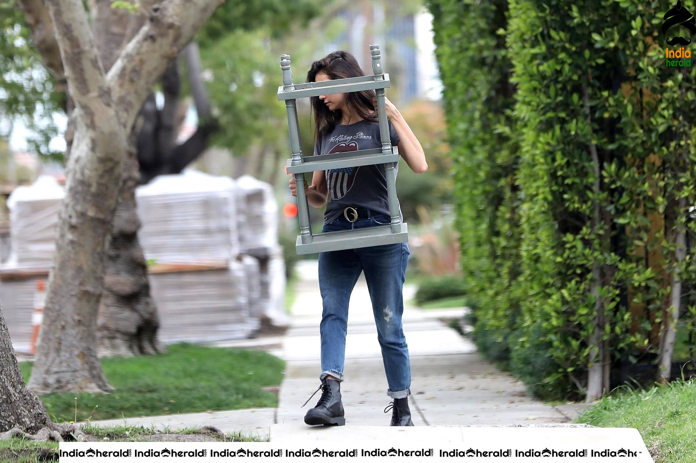 Nina Dobrev caught by Paparazzi while carrying furniture to a car in Los Angeles