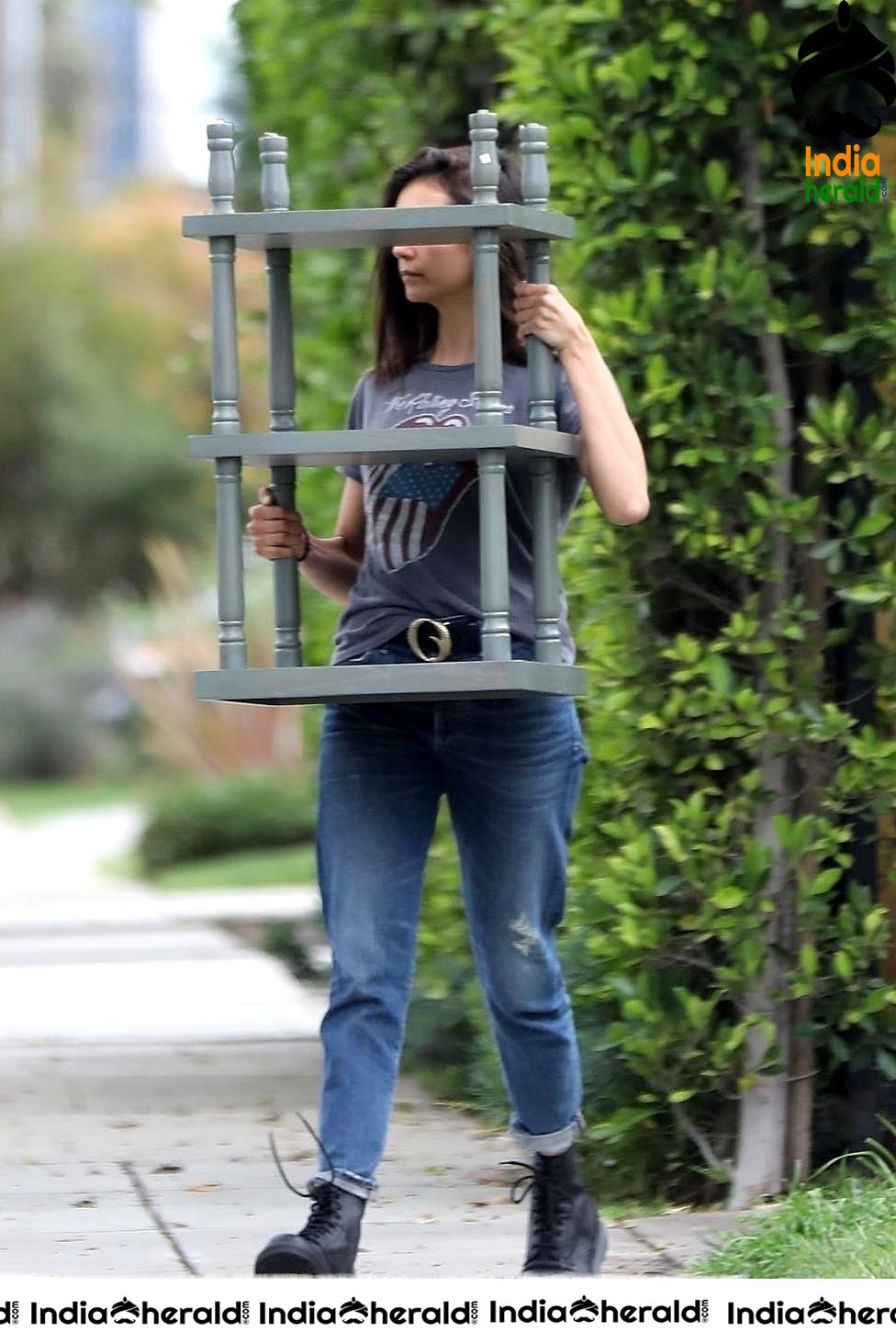 Nina Dobrev caught by Paparazzi while carrying furniture to a car in Los Angeles