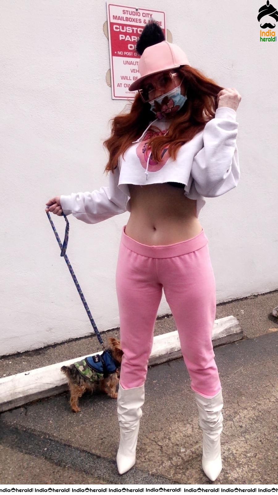 Phoebe Price shows her midriff and wears a mask due to Corona in West Hollywood