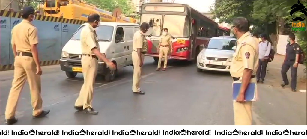 Police check passes and identity cards of people in Mumbai due to Corona Virus Lockdown