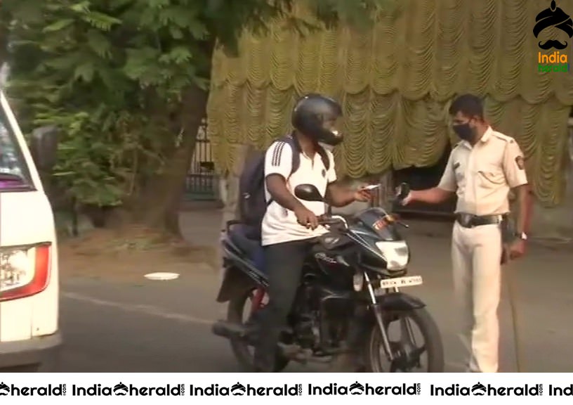 Police check passes and identity cards of people in Mumbai due to Corona Virus Lockdown