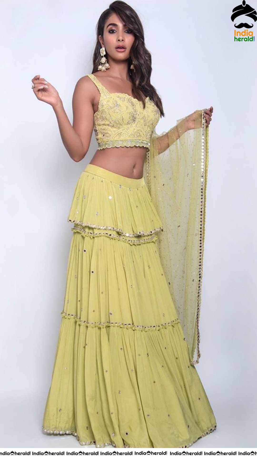 Pooja Hegde Flaunts her Sexy Waist and Cleavage in Yellow Blouse and Skirt