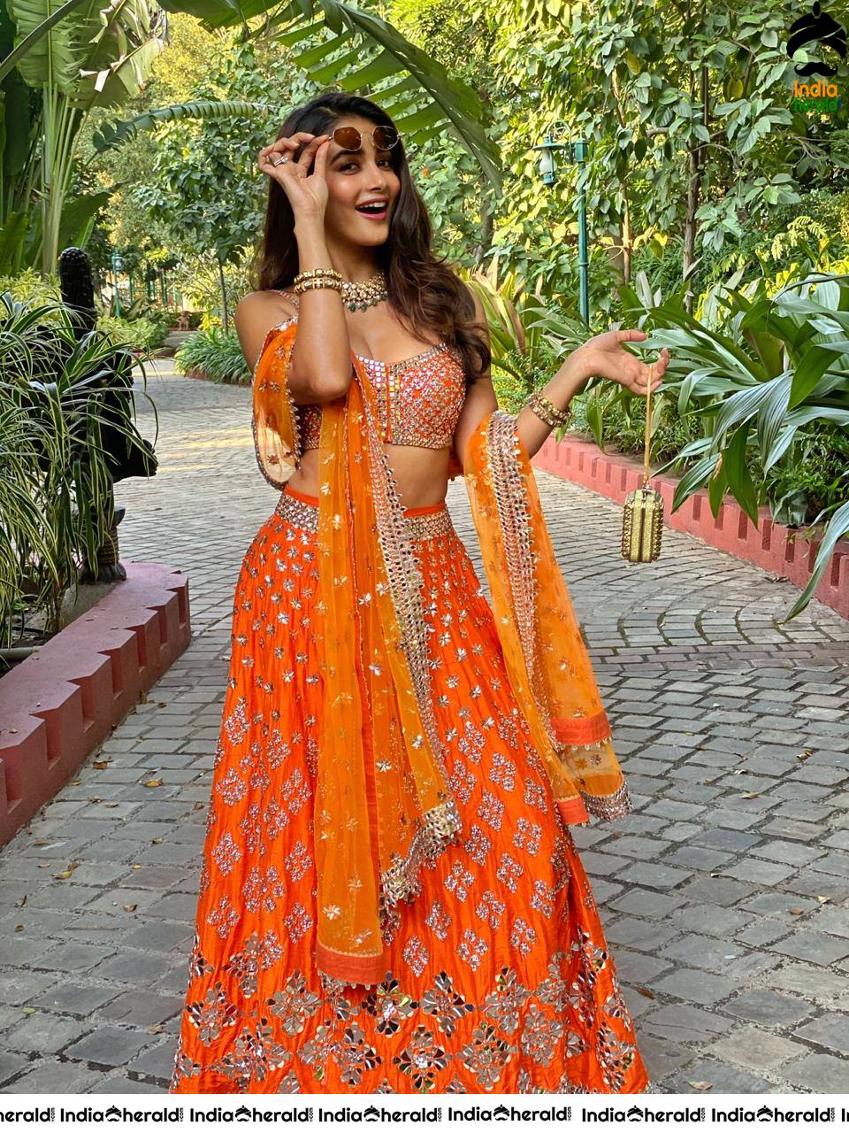 Pooja Hegde shows her teasing Waistline in Sleeveless Blouse and Long Skirt at a Function