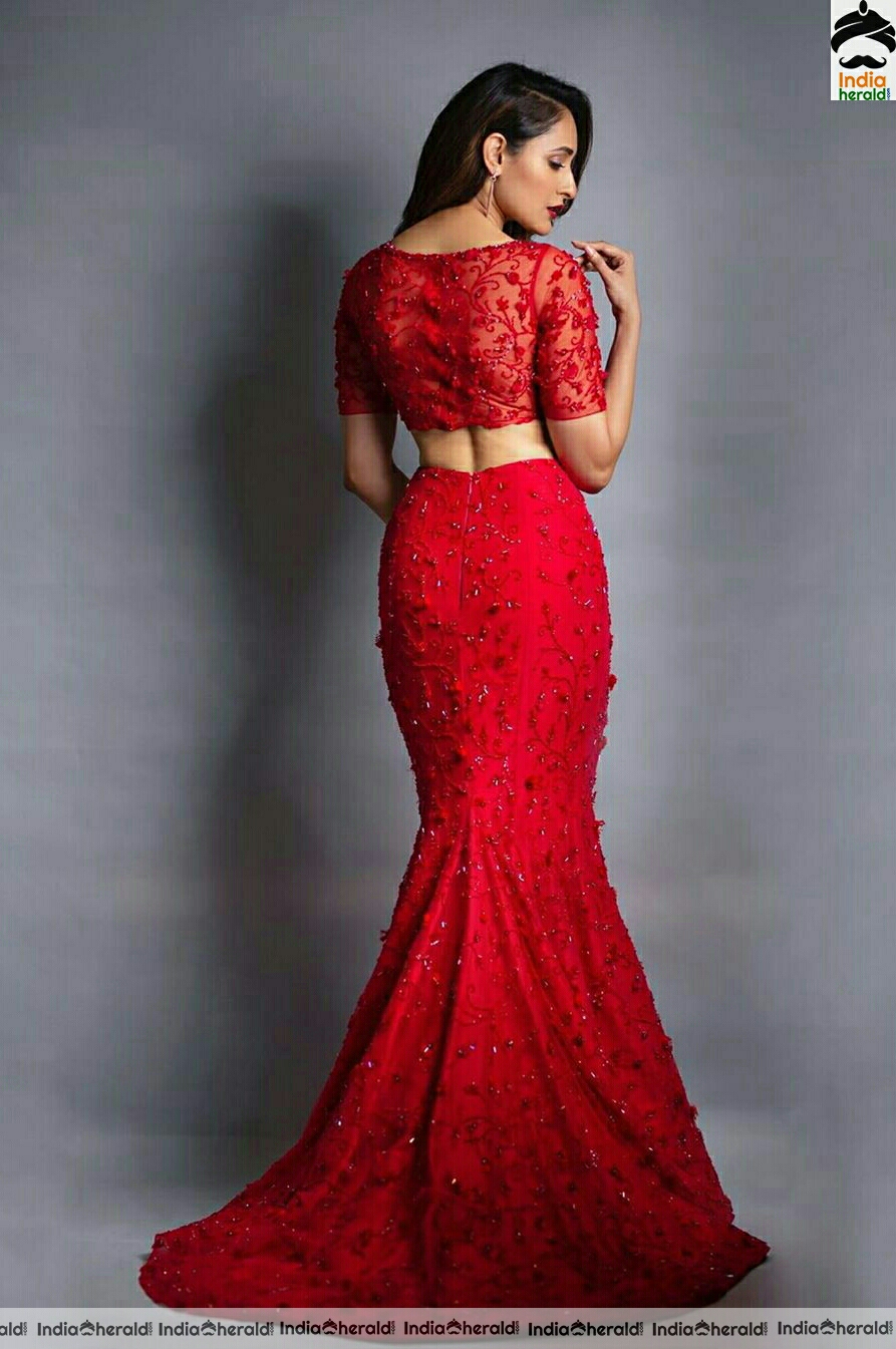 Pragya Jaiswal Hot In Red Dress Stills