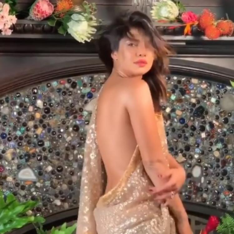 Priyanka Chopra Flaunting Her Sexy Back In A Golden Saree