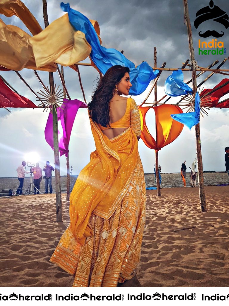 Raashi Khanna Showing Her Hot Curves in Yellow Half Saree
