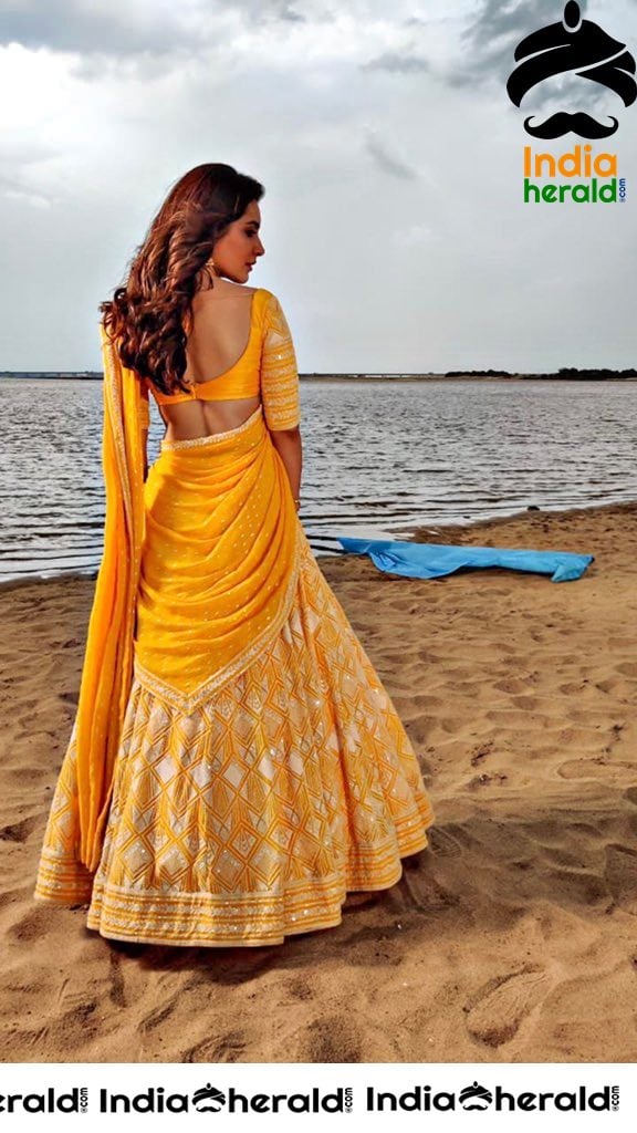 Raashi Khanna Showing Her Hot Curves in Yellow Half Saree
