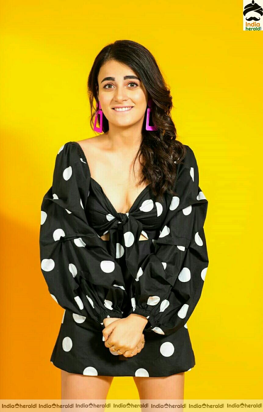 Radhika Madan Hot Cleavage Show In Black Short Frock