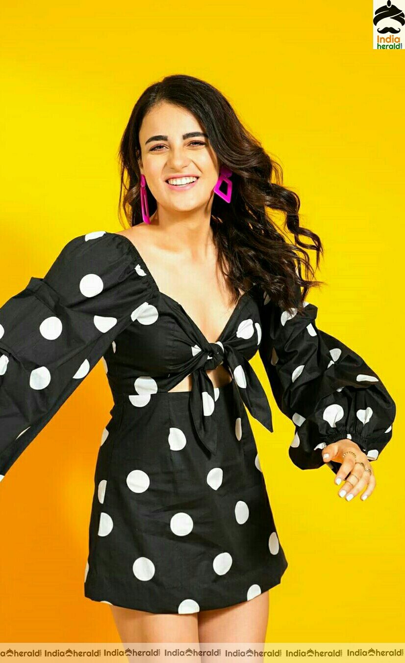 Radhika Madan Hot Cleavage Show In Black Short Frock