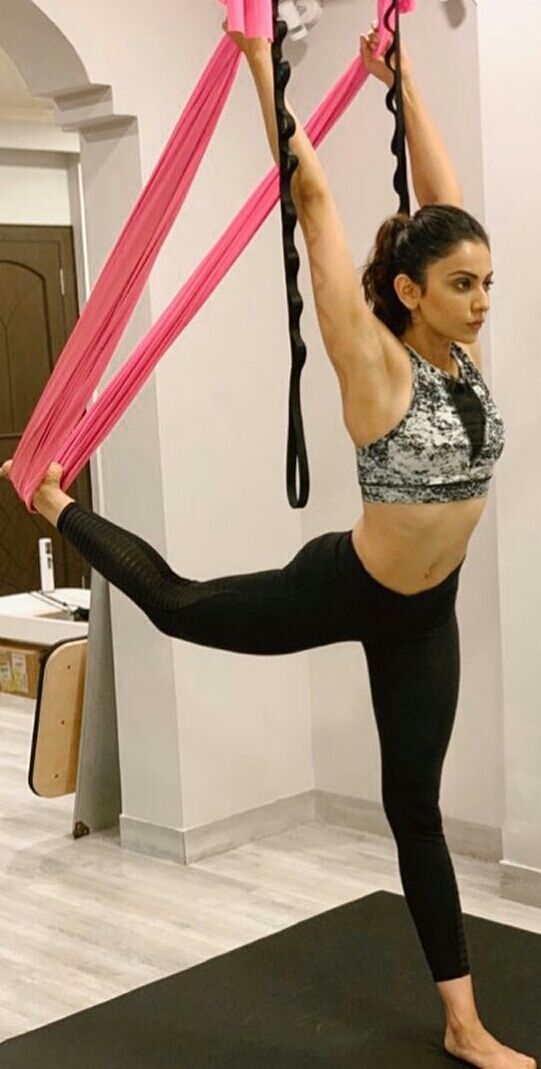 Rakul Preet Flexes Her Muscles While Duing Yoga