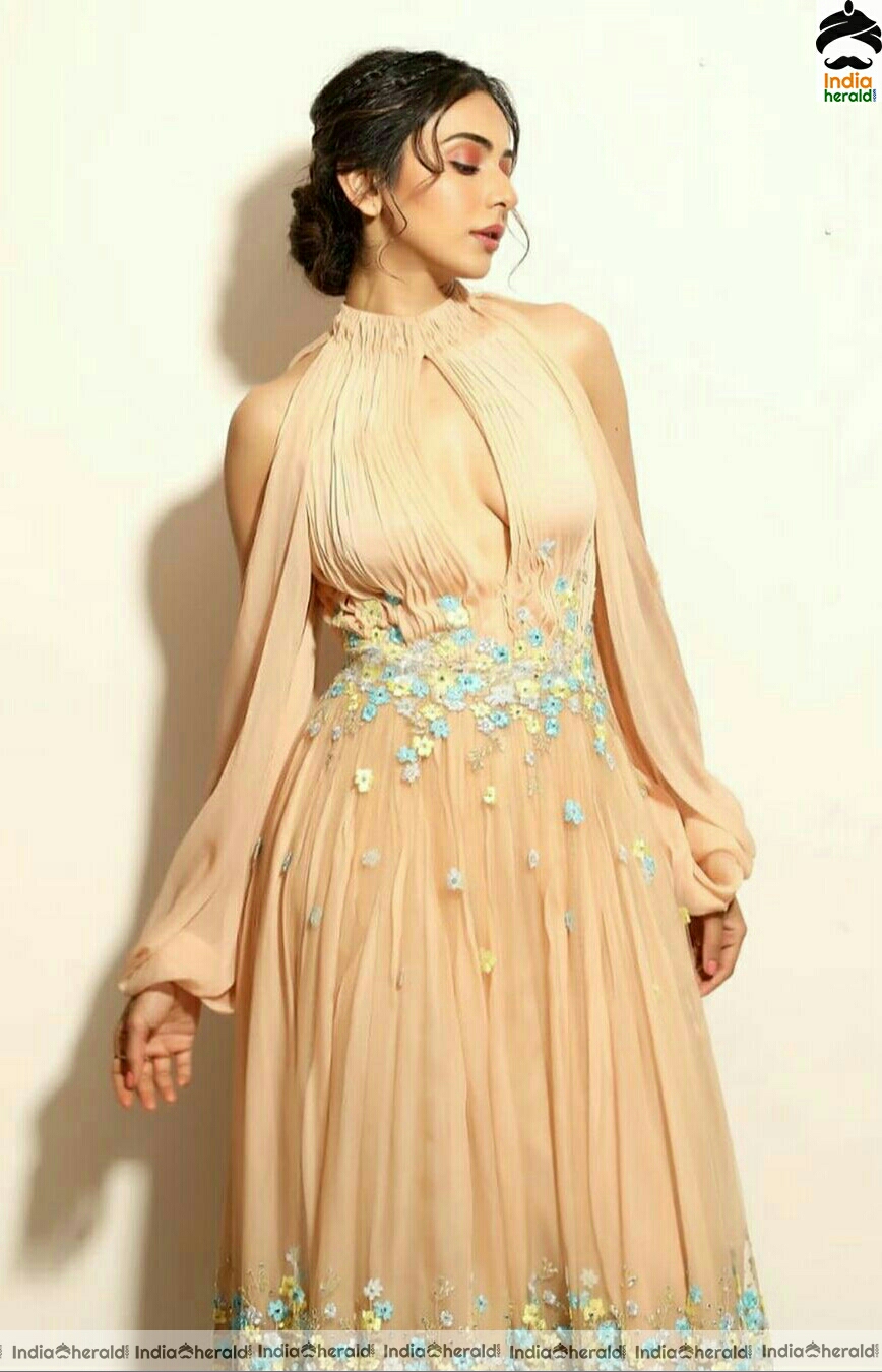 Rakul Preet Hot In Golden dress stills