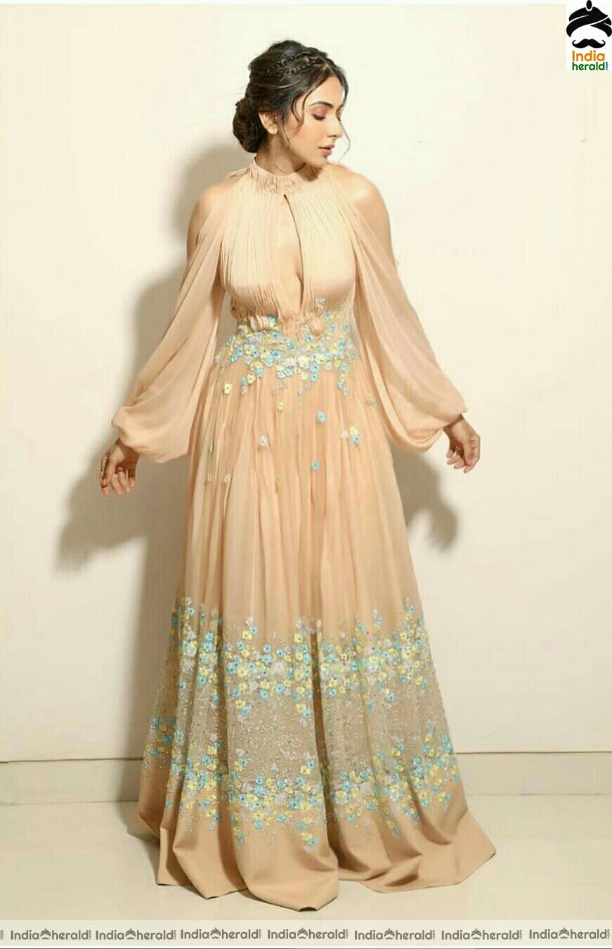 Rakul Preet Hot In Golden dress stills