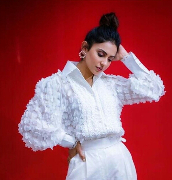 Rakul Preet Shines In White During Red Background Shoot