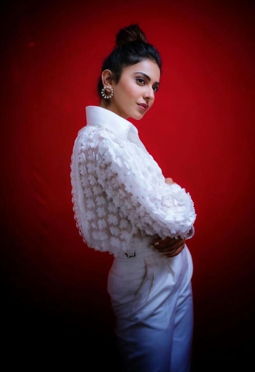 Rakul Preet Shines In White During Red Background Shoot