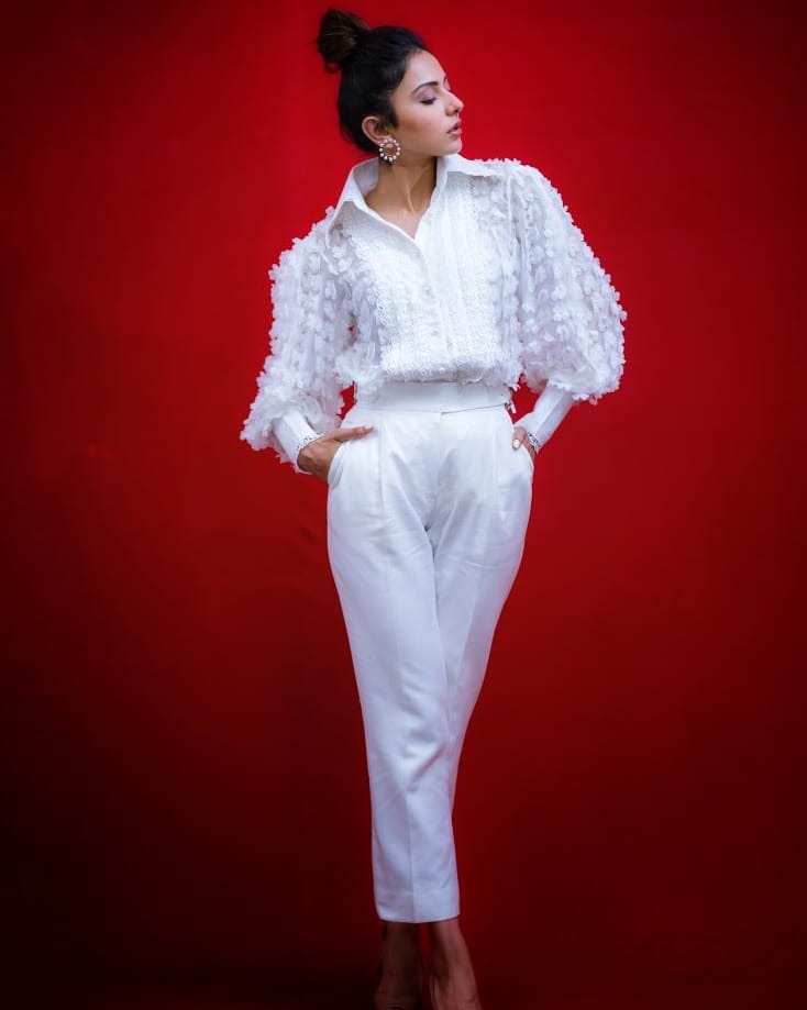 Rakul Preet Shines In White During Red Background Shoot
