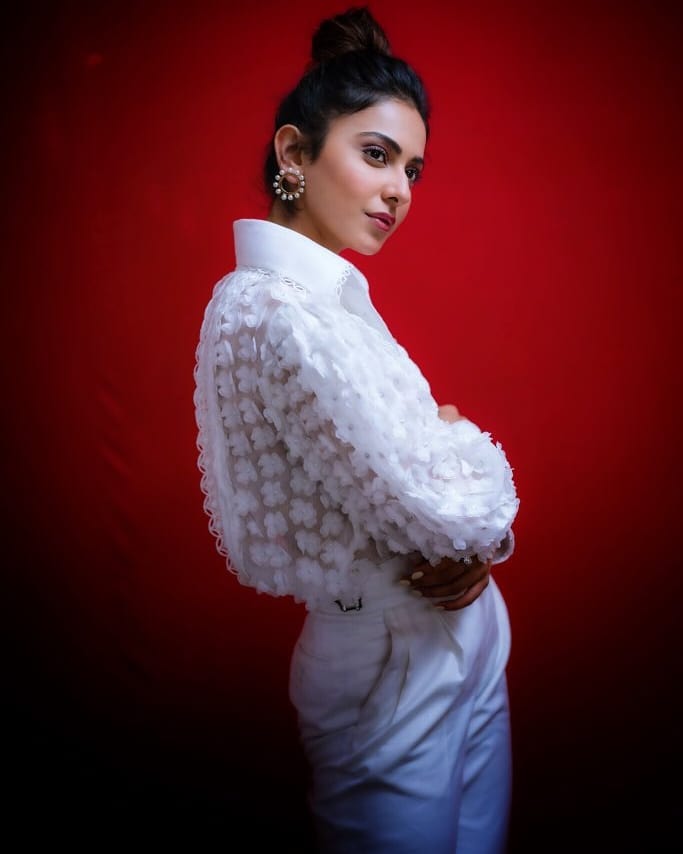 Rakul Preet Shines In White During Red Background Shoot