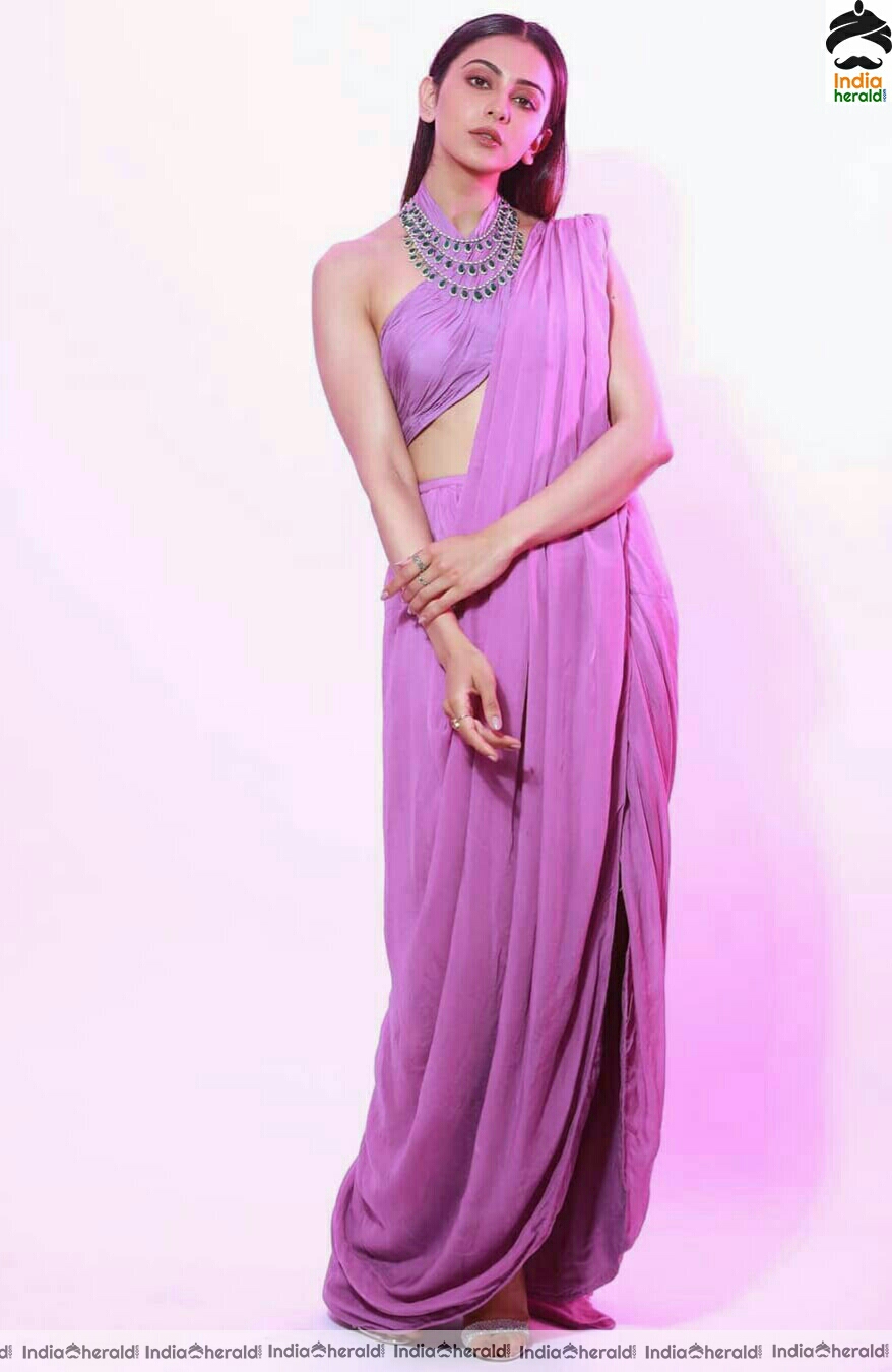Rakul Preet Shows Her Hot Sexy Waist In Purple Saree Stills