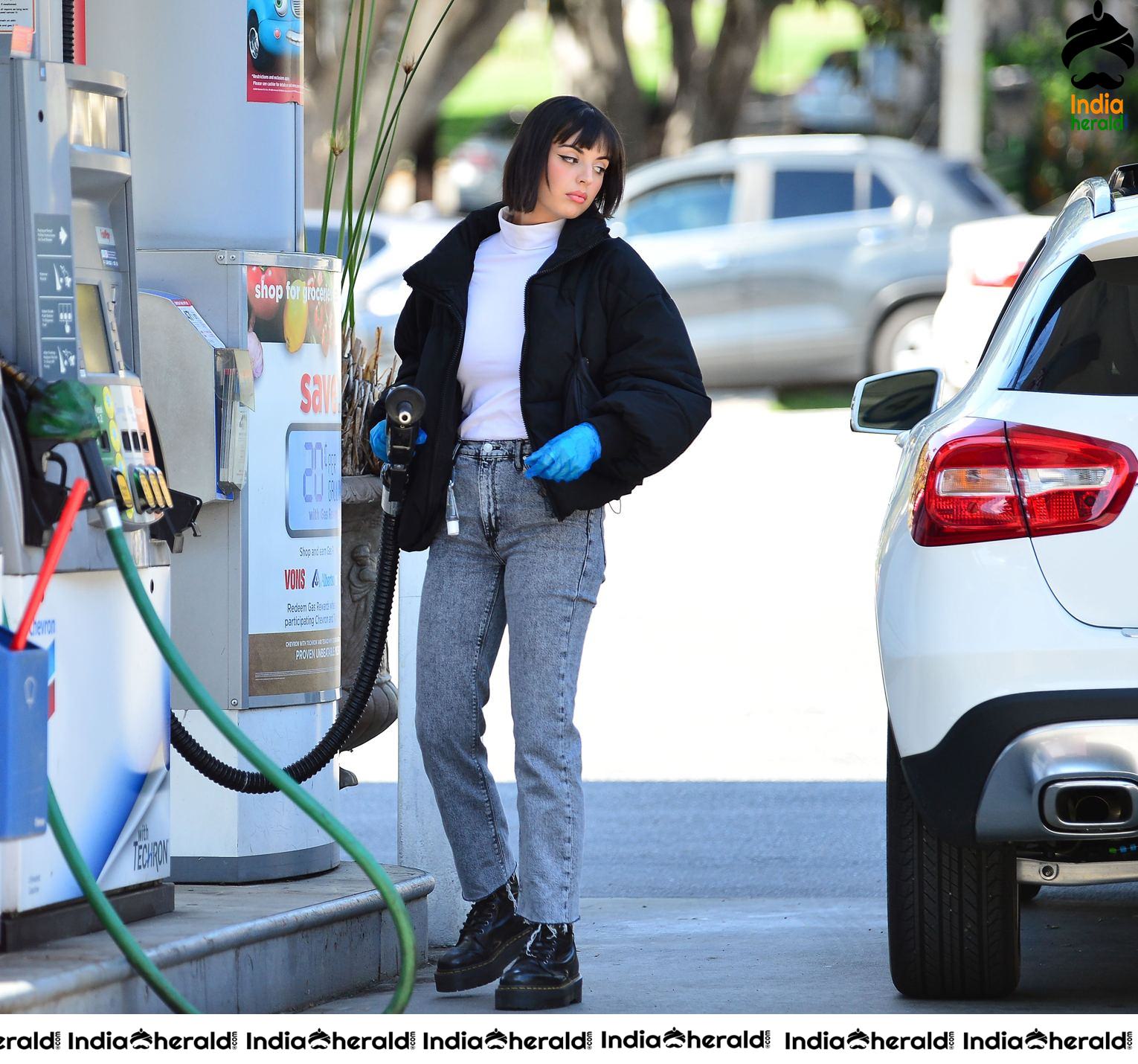 Rebecca Black pumping gas in Los Angeles