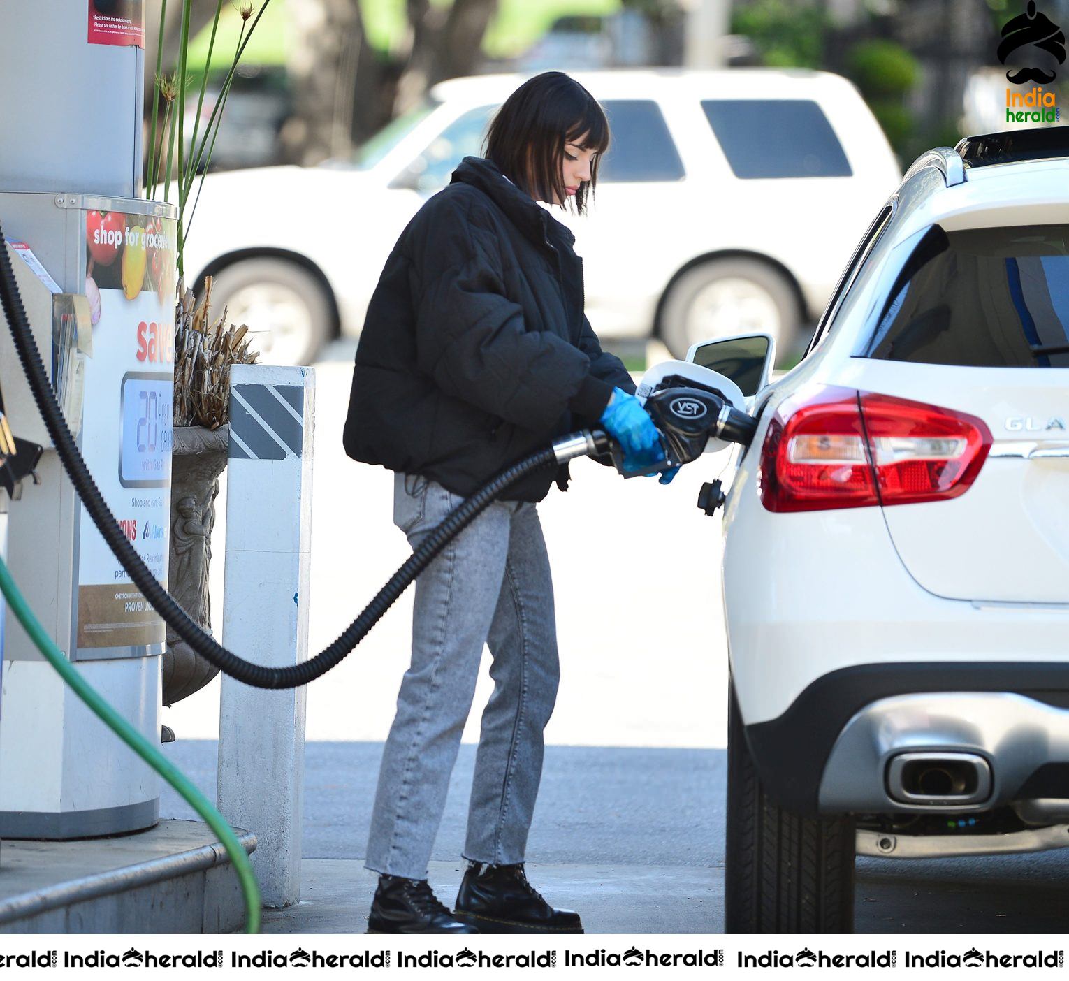 Rebecca Black pumping gas in Los Angeles
