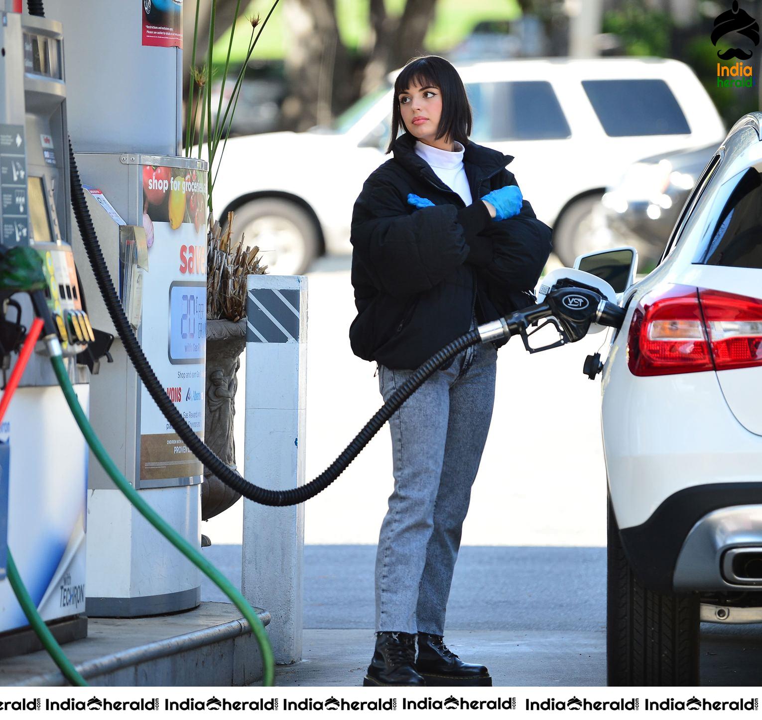Rebecca Black pumping gas in Los Angeles