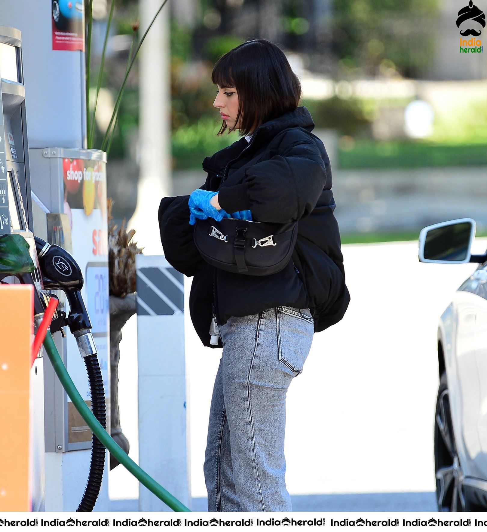Rebecca Black pumping gas in Los Angeles