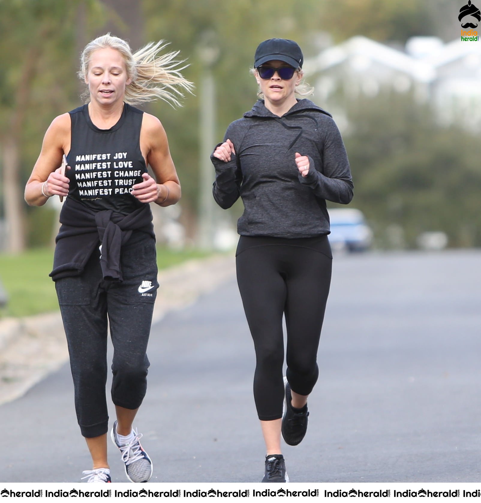 Reese Witherspoon seen jogging with a friend in Los Angeles