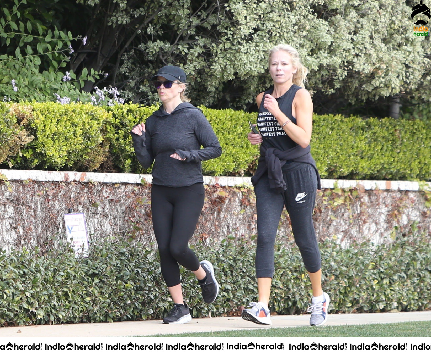 Reese Witherspoon seen jogging with a friend in Los Angeles