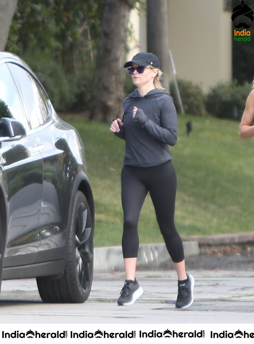 Reese Witherspoon seen jogging with a friend in Los Angeles