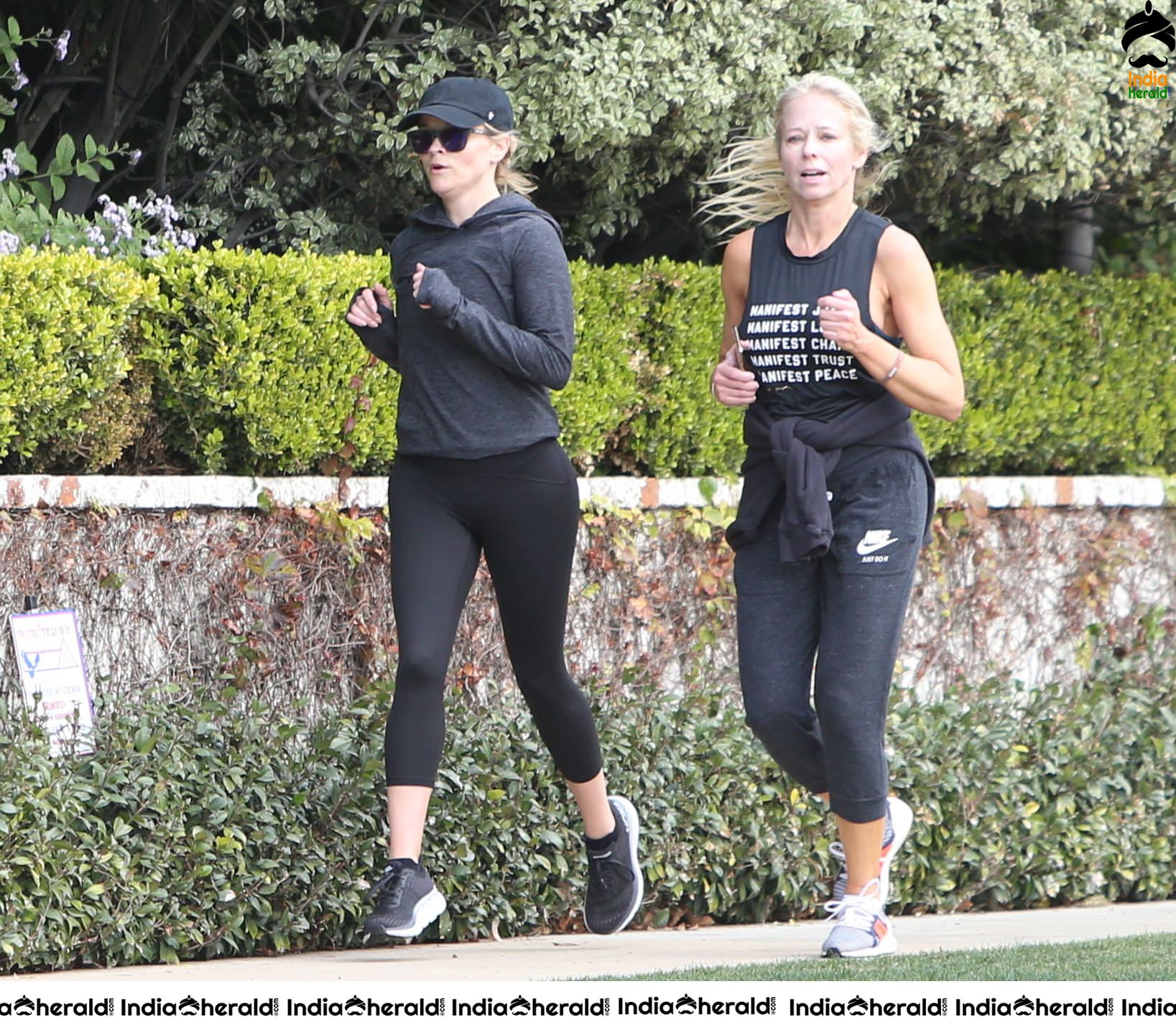 Reese Witherspoon seen jogging with a friend in Los Angeles