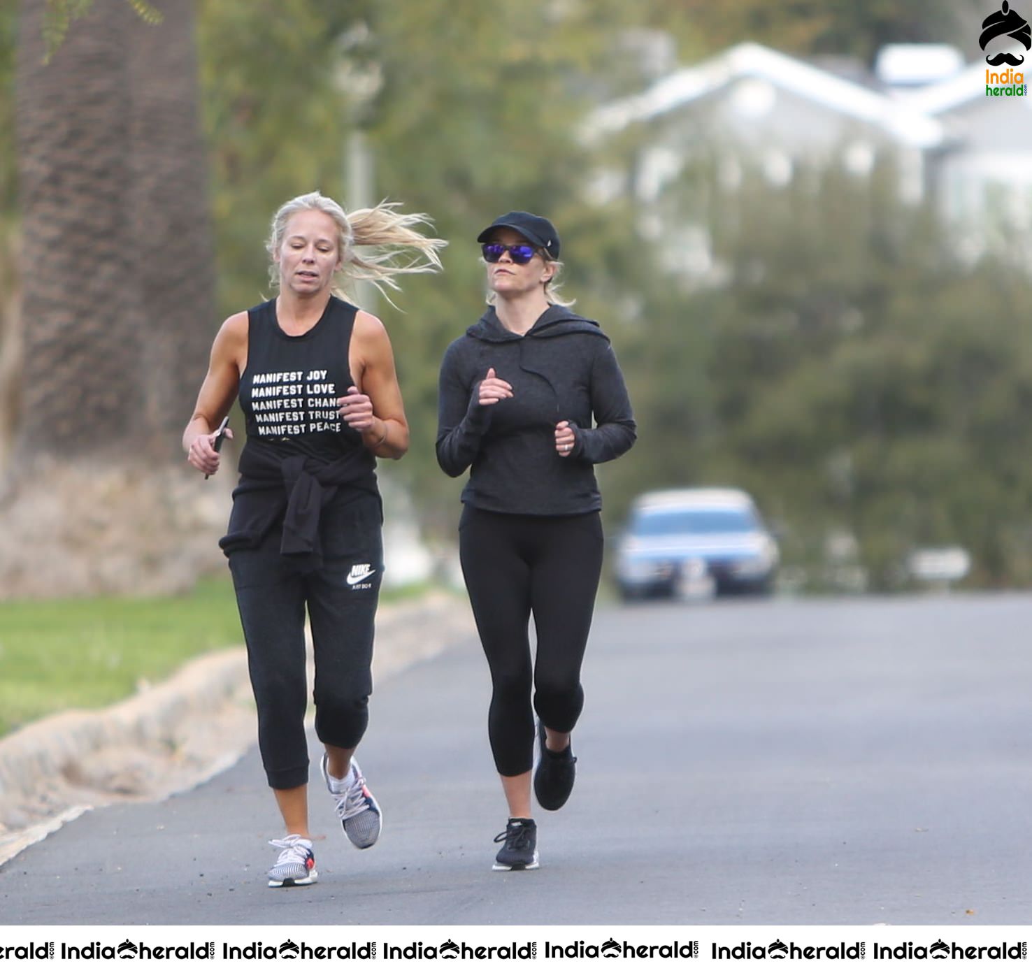 Reese Witherspoon seen jogging with a friend in Los Angeles