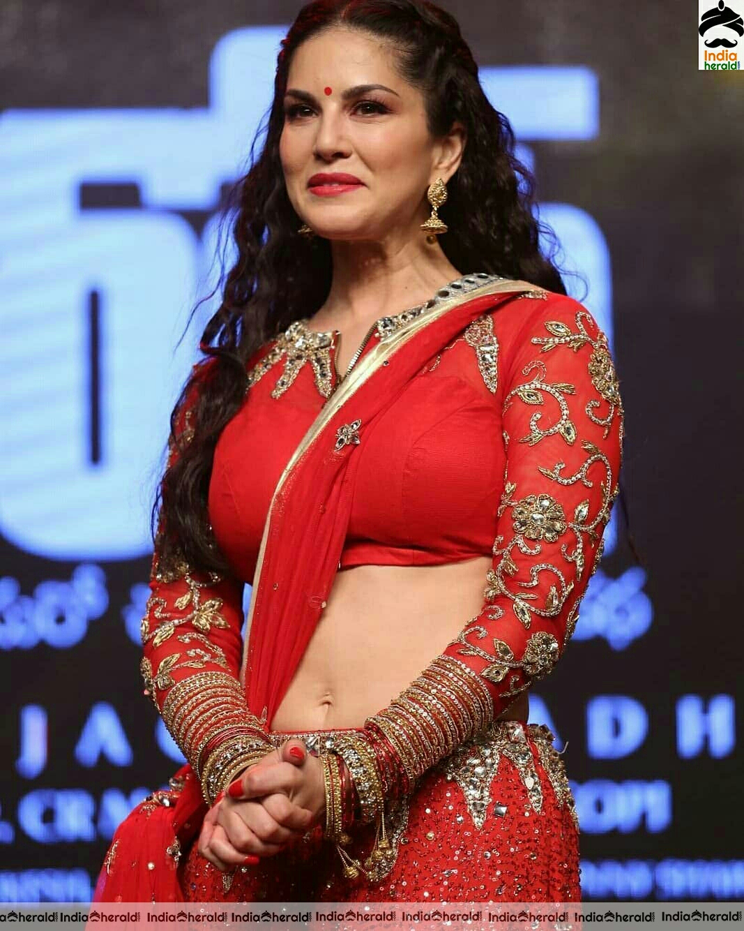 Sunny Leone Shows Her Hot Waist In Red Choli Stills
