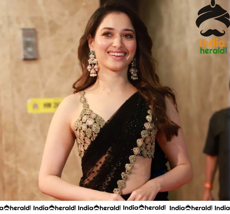 Tamanna Shows her Hot White Milky Waist in Black Saree at a Hotel Lobby