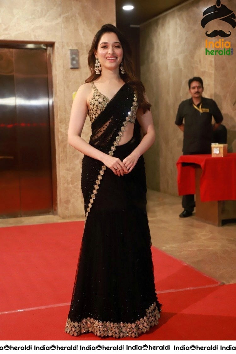 Tamanna Shows her Hot White Milky Waist in Black Saree at a Hotel Lobby