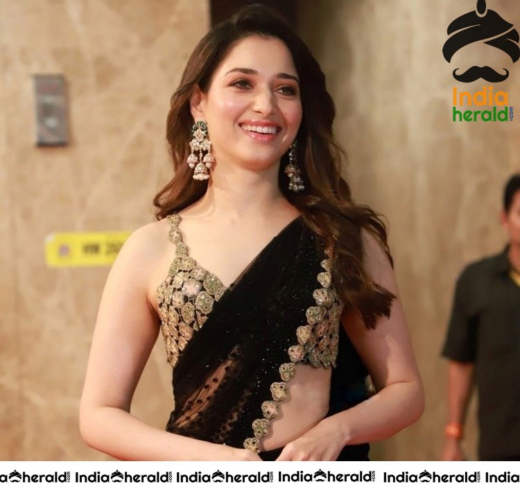 Tamanna Shows her Hot White Milky Waist in Black Saree at a Hotel Lobby