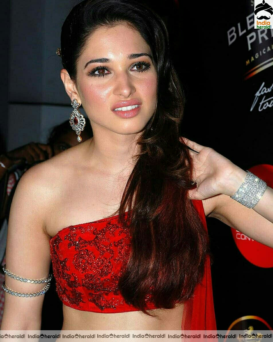 Tamanna Shows her Sexy Waist In Red Dress Stills