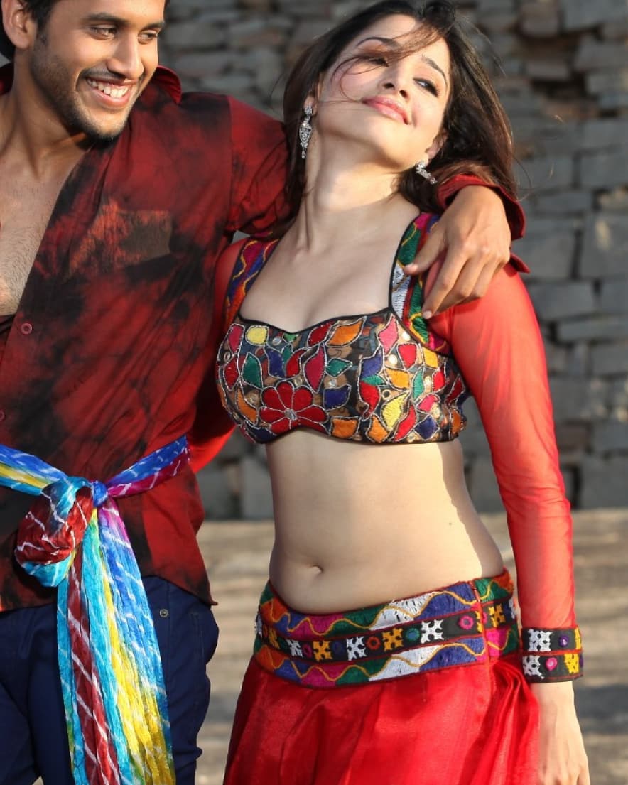 Tamannaah Shows Her Sexy Milky Mid Riff And Navel With Various Actors