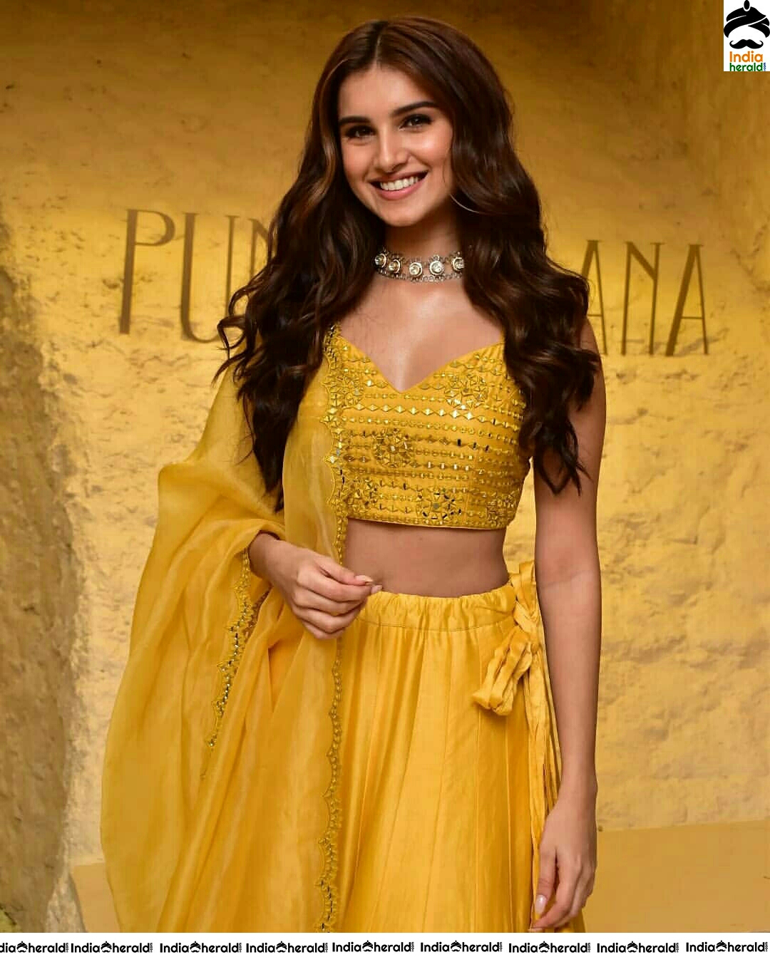 Tara Sutaria Sizzling In Yellow Waistline Revealing Dress