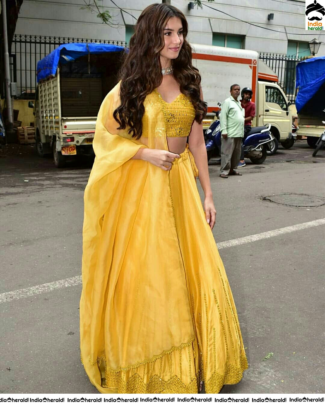 Tara Sutaria Sizzling In Yellow Waistline Revealing Dress