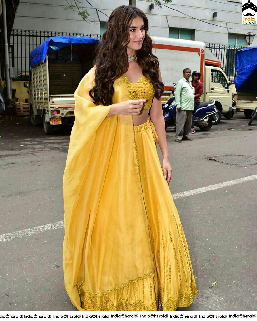 Tara Sutaria Sizzling In Yellow Waistline Revealing Dress