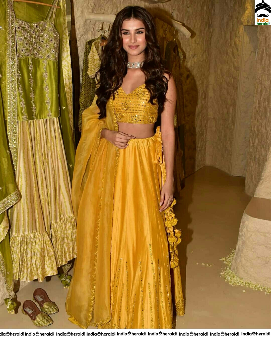 Tara Sutaria Sizzling In Yellow Waistline Revealing Dress